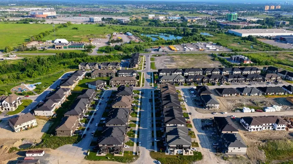 Aerial view of a residential neighborhood, illustrative of the kind of communities served by local housing authorities